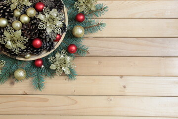 Christmas background with pine cones, spruce branches and Christmas decorations