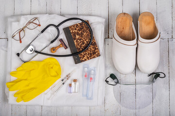 Basic medical kit prepared for vaccinations. Protective clothing and medical accessories.