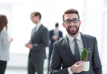 businessman with green young escape on blurred background