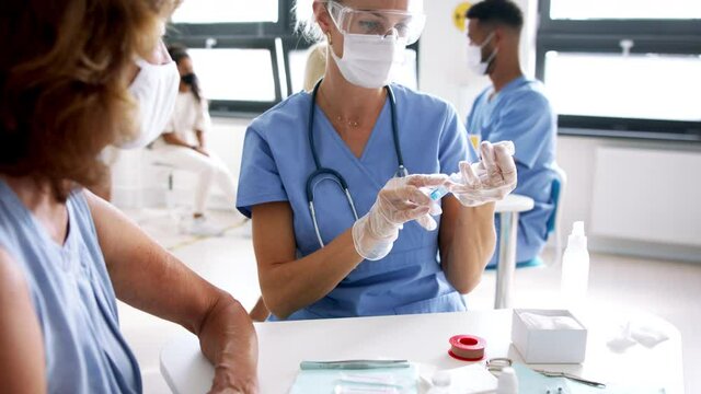 Woman with face mask getting vaccinated, coronavirus, covid-19 and vaccination concept.