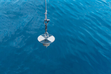 Fototapeta na wymiar Transparency measurement with secchi disk in the ocean