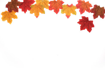 Fototapeta na wymiar Artificial maple leaves in autumn background as wallpaper with copy space, Maple leaves in winter season, Frame, Backdrop, Top view 