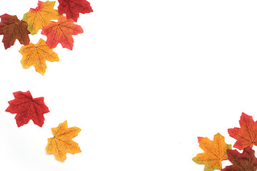 Artificial maple leaves in autumn background as wallpaper with copy space, Maple leaves in winter season, Frame, Backdrop, Top view 