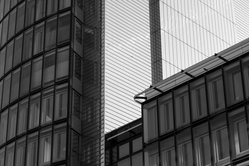 Black and white tone, Exterior architectural detail of mixture facade elements and material of modern office buildings. Abstract Urban metropolis background.