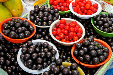 Acerola cherries and Brazilian grapetree fruits on marketplace in Ipanema neighborhood 