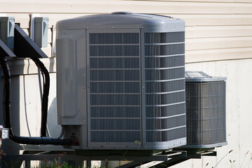 Air conditioning system unit installed outside facade of the new house fan modern