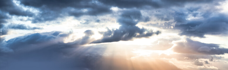 Dramatic Panoramic View of a cloudscape during a cloudy and colorful sunset. Taken over Alaska, USA.