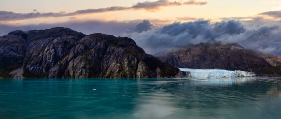 Beautiful Panoramic View of Margerie Glacier in the American Mountain Landscape on the Ocean Coast. Dramatic Sunset Sky Art Render. Glacier Bay National Park and Preserve, Alaska, USA.