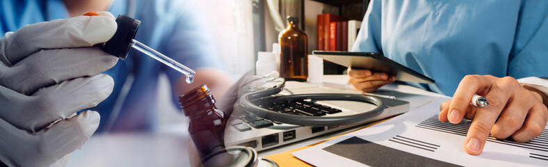 Medical technology concept The doctor works with mobile phones, headphones and tablets. Digital laptop in the modern office at the hospital in the morning