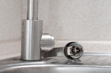 The handle for opening the water in the kitchen faucet has come off due to poor quality materials