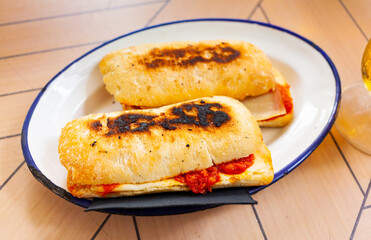 traditional latin spicy sandwich in white plate for brunch