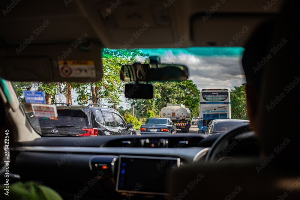 Wall mural nakhon sawan, thailand, apr 12, 2019 - traffic jam on the road during long holiday from inside car v