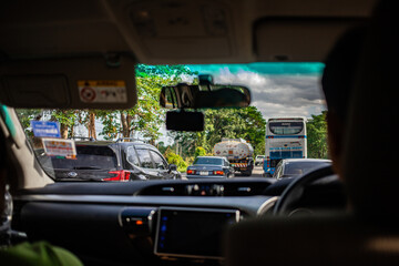 Nakhon Sawan, Thailand, Apr 12, 2019 - Traffic jam on the road during long holiday from inside car view