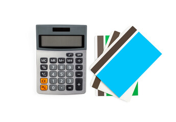 Saving account passbook and green power office desktop calculator with solar cell power isolated on white background with path.