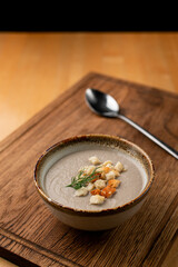 Creme champignon soup restaurant serving, close up restaurant serving