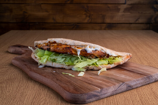 Closeup of a sandwich  on a cut board