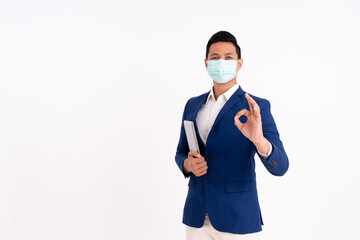 Portrait of a happy businessman. Showing OK sign with masks for health