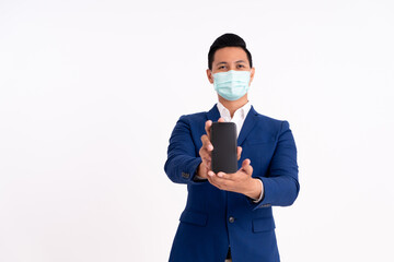 Portrait of a happy businessman. Showing copy space on the phone with masks for health