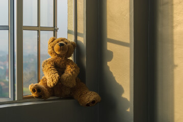 teddy bear in window