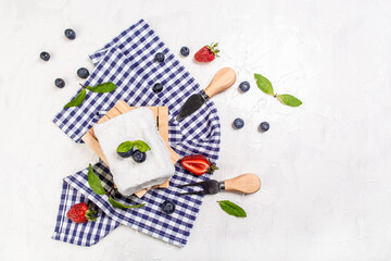 goat cheeses crottin de chavignol. Soft french cheese with ash, goat cheeses, home made cheese farmer on a light background, top view. The concept of natural eco dairy products