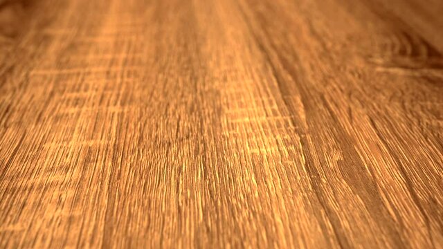 Flooring made of new installed wood floor planks in natural clear oak or maple wood.
