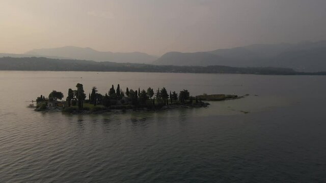 San Biagio known as Rabbits Island lake Garda, Italy. Orbital aerial view