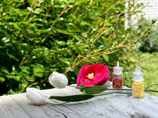 Colorful glitters for nail art and makeup in small glass jars isolated