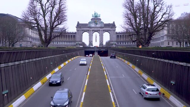 Traffic passing the Cinquantenaire arch in Brussels, Belgium during a winter's day