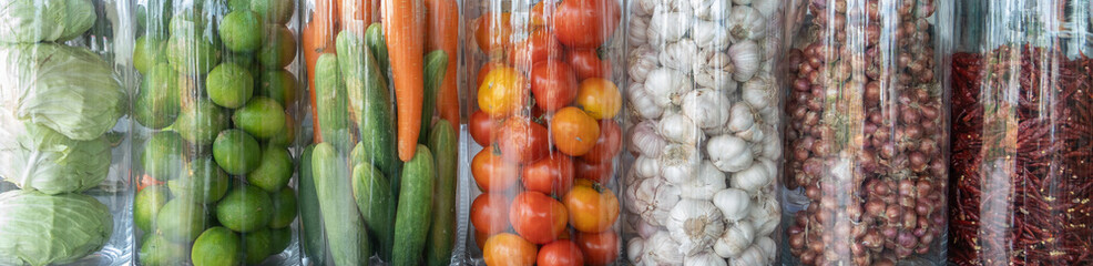 Fresh vegetables in a glass jar Arranged in an orderly manner for the convenience of choosing to cook.Healthy eating and detox concept