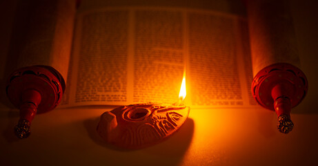 Ancient Lamp Illuminating the Hebrew Text of the Torah