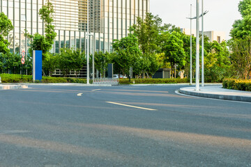 Fototapeta na wymiar clean asphalt road through office block area, suzhou, china