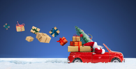 Santa Claus in Red car delivering christmas or New Year gift boxes on a blue snowy background.