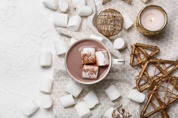 Fototapeta na wymiar Cup of hot cacao drink with marshmallows and Christmas decorations on white background