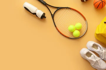 Fotobehang Set of sport equipment on color background © Pixel-Shot
