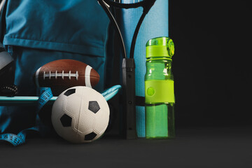 Set of sport equipment on dark background