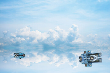 reflection two car was parking on water on of lake and blue sky and white cloud