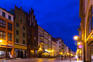 Fototapeta na wymiar Cityscape of Torun with vibrant streets at spring twilight, Poland