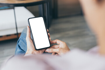 cell phone blank white screen mockup.woman hand holding texting using mobile on desk at office.background empty space for advertise.work people contact marketing business,technology