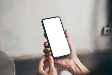 cell phone blank white screen mockup.woman hand holding texting using mobile on desk at office.background empty space for advertise.work people contact marketing business,technology