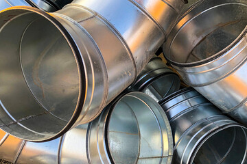 Halvanized ventilation pipe elbows. Industrial metal pipes