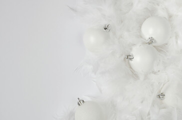 Festive composition , white balloons lying on white feathers, minimalism, space for text