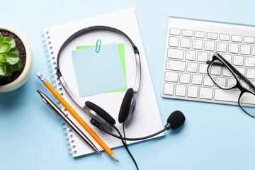 Office desk with headset and supplies
