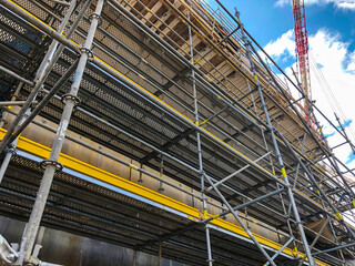 Scaffoldings at construction site. Auxillary construction equipment