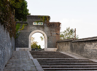 Historic stone stairs & gate to Xijin Ancient Ferry Street in Zhenjiang, Jiangsu, China. Tourist...
