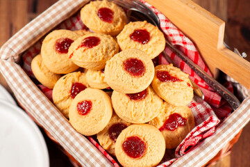Delicious fresh baked jam drop biscuits, food background.