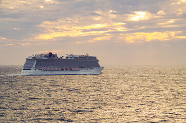 Dream vacation on modern Norwegian cruiseship or cruise ship liner Escape at sea during sunrise...