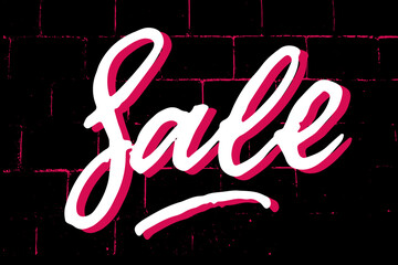Sale brush textured hand written lettering sign. White shadowed letters on black and neon pink brick wall background. Advertising concept for sale season and discount banner. Promotional text for