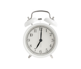 White alarm clock with black hands of a watch showing seven hours isolated or cut out on white background