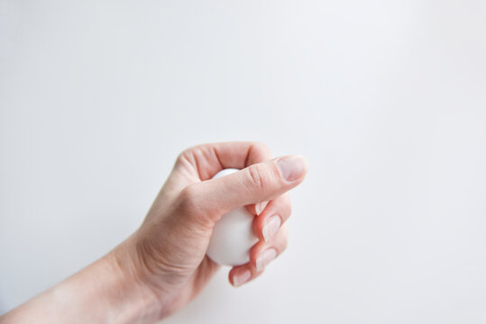 selective focus at the white egg in the hand