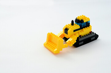 Obraz premium ブロックでできたブルドーザー